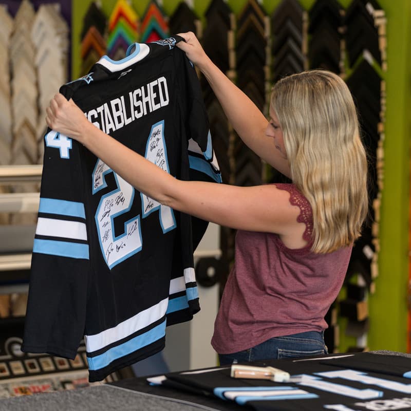 Professional jersey framing service at Pixels Foto & Frame